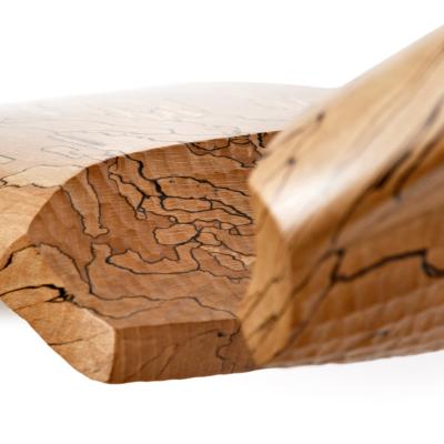 handcarved detail on stylized wings